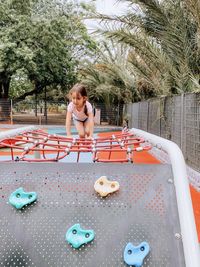 Full length of woman sitting on boat