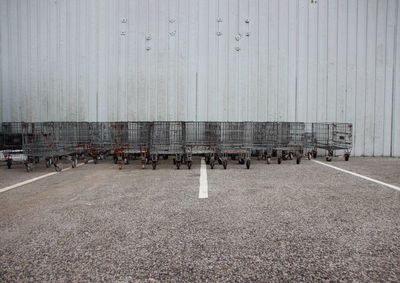 Shopping carts against wall on road