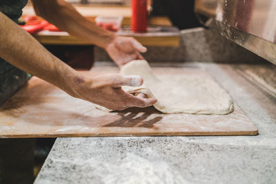 Midsection of man preparing food