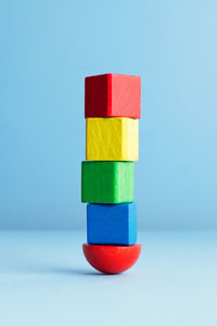 Close-up of colorful balloons against blue background