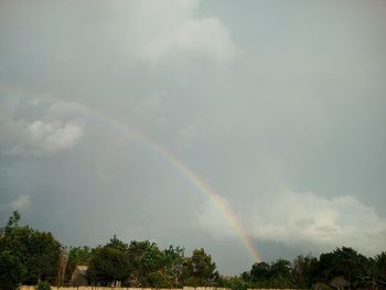 Low angle view of rainbow against sky