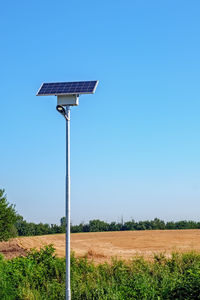 Led street light with solar cell on clear sky,