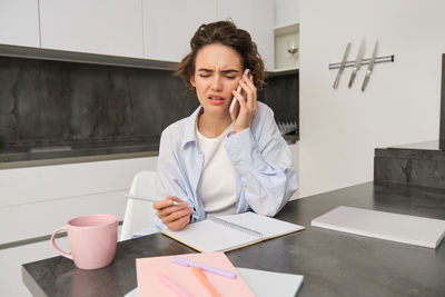 Businesswoman working at table