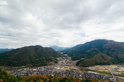 Scenic view of mountains against cloudy sky