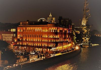 Illuminated buildings in city at night