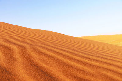 Scenic view of desert against clear sky