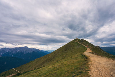 Panoramic view on dolomites, old refuge helmet hut.