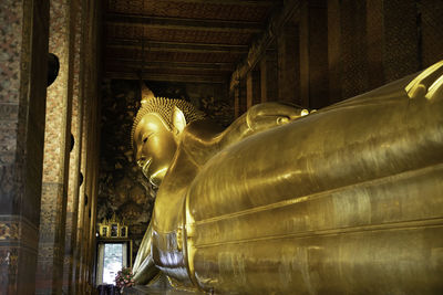 Low angle view of statue against building