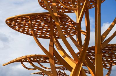 Low angle view of metallic structure against sky