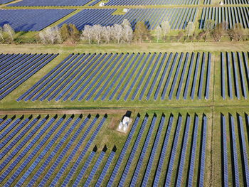 Drone aerial view power station producing clean, sustainable solar energy in italy