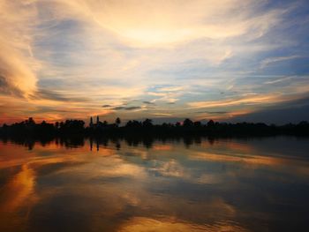 Scenic view of lake against sky during sunset