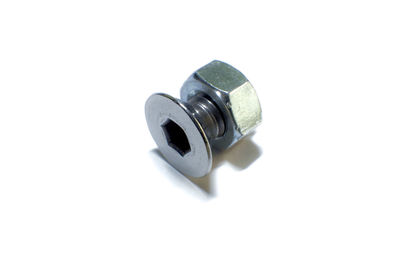 High angle view of nut and bolt on white background