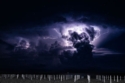 Panoramic view of lightning against sky at night