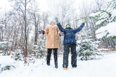 People standing on field during winter