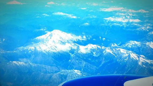 Aerial view of sea against blue sky