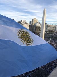 Low angle view of flag against sky