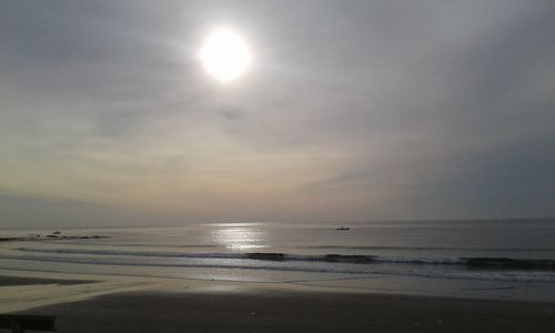 Scenic view of sea against sky at sunset