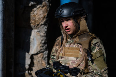 Army soldiers standing against wall