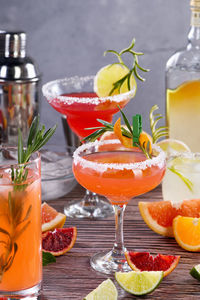 Pink paloma cocktail with grapefruit juice, tequila and rosemary