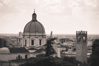 View of buildings in city against sky