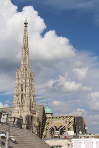 Low angle view of temple against cloudy sky