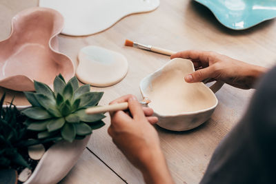 High angle view of woman preparing food on table