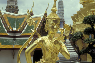 Statue of temple outside building