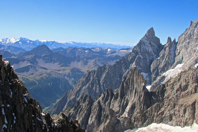 Scenic view of snowcapped mountains against clear sky