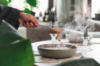 Midsection of man preparing food