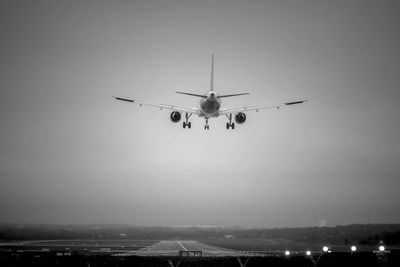 Low angle view of airplane flying in sky