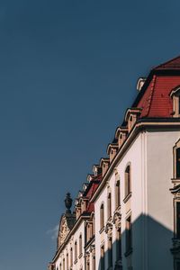 Low angle view of buildings against clear sky