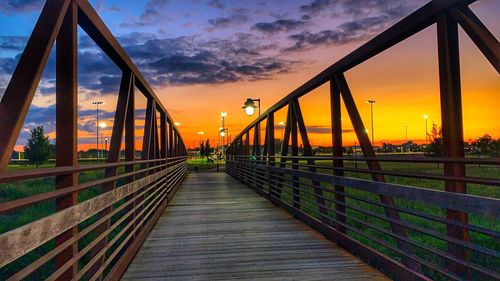 View of suspension bridge against sky during sunset