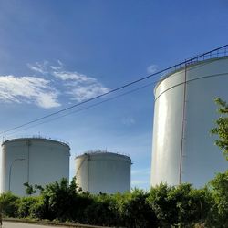 Low angle view of factory against sky