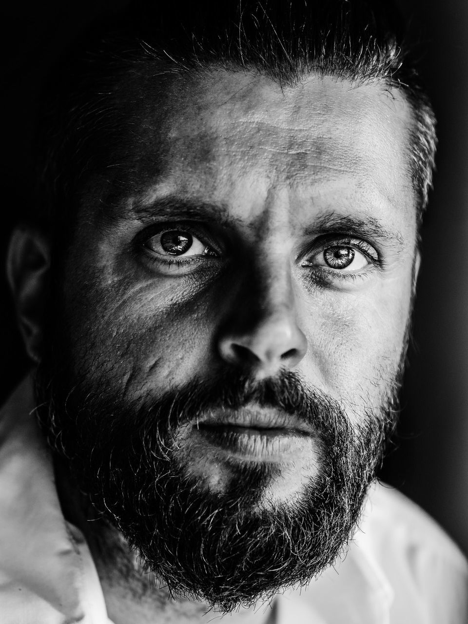 headshot, young adult, beard, young men, close-up, looking at camera, leisure activity, portrait, lifestyles, serious, person, human face, focus on foreground, one mid adult man only, human hair, mature adult, studio shot