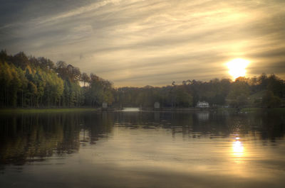 Scenic view of lake against sky during sunset