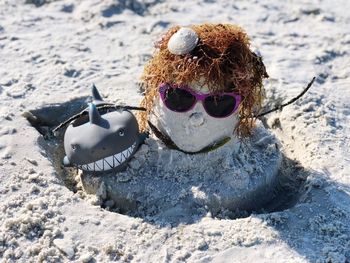 High angle view of toy on sand