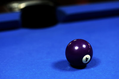 Close-up of blue ball on pool table