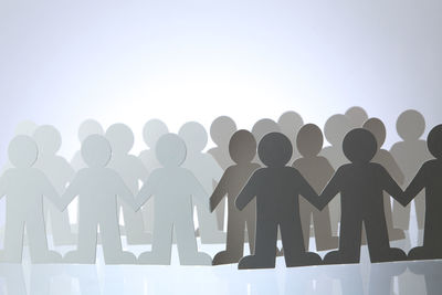 Low angle view of silhouette man against white background