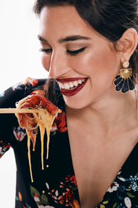 Close-up of a young woman holding ice cream