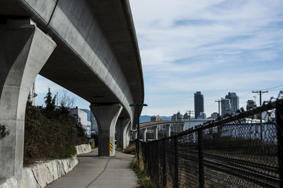 View of skytrain bridge against sky