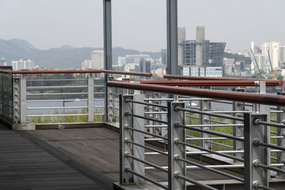 View of buildings against sky seen from balcony