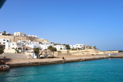 Scenic view of sea against clear blue sky