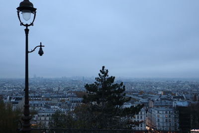 Low angle view of street light against sky