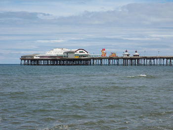 Pier over sea against sky