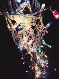 Low angle view of illuminated ferris wheel