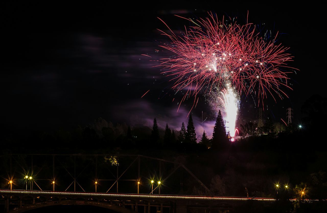 night, illuminated, firework display, long exposure, celebration, exploding, firework - man made object, motion, glowing, sparks, firework, event, arts culture and entertainment, entertainment, blurred motion, sky, celebration event, fire - natural phenomenon, low angle view, multi colored