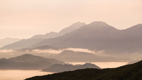 Scenic view of mountains against sky during sunset