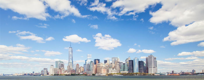 City skyline against cloudy sky