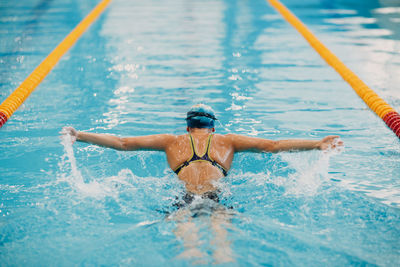 Man swimming in pool