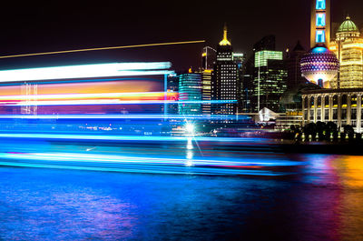 Light trails on city street at night